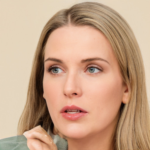 Neutral white young-adult female with long  brown hair and green eyes