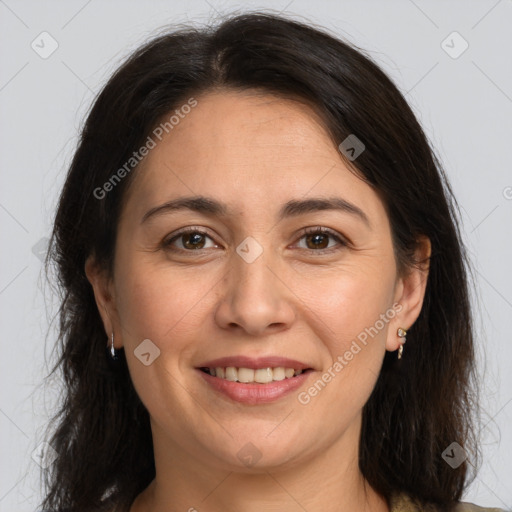 Joyful white adult female with long  brown hair and brown eyes