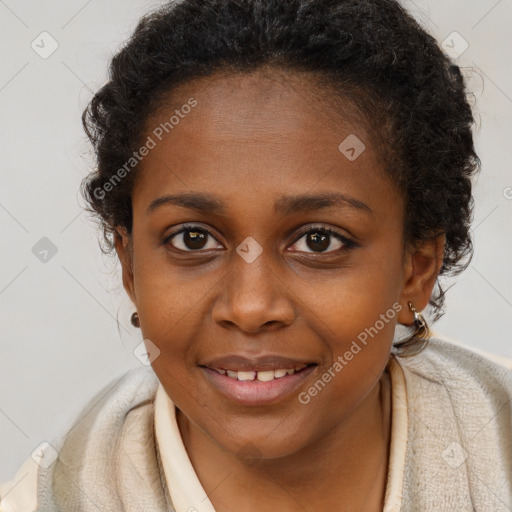 Joyful black young-adult female with long  brown hair and brown eyes