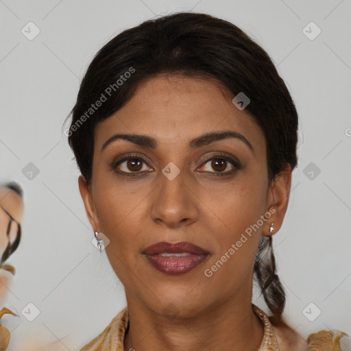 Joyful latino young-adult female with medium  brown hair and brown eyes