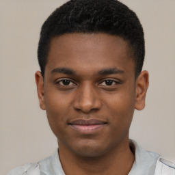 Joyful latino young-adult male with short  brown hair and brown eyes