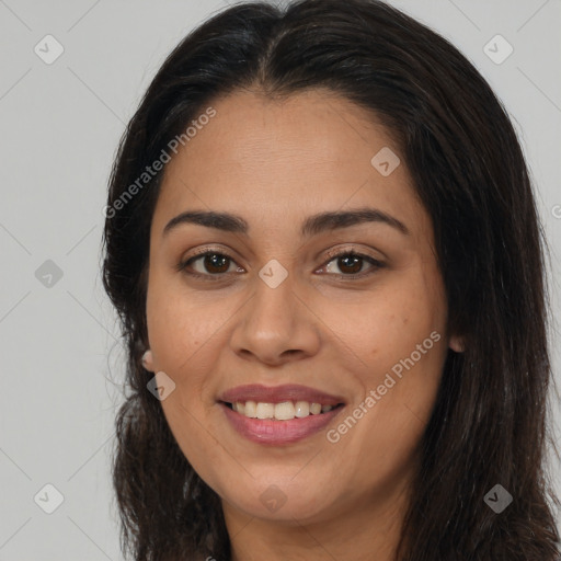 Joyful latino young-adult female with long  brown hair and brown eyes