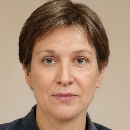 Joyful white adult female with short  brown hair and grey eyes