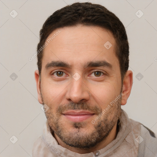 Joyful white adult male with short  brown hair and brown eyes