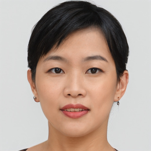 Joyful asian young-adult female with short  black hair and brown eyes