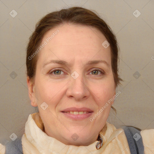 Joyful white adult female with medium  brown hair and blue eyes