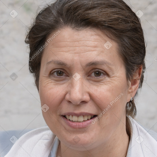 Joyful white adult female with medium  brown hair and brown eyes