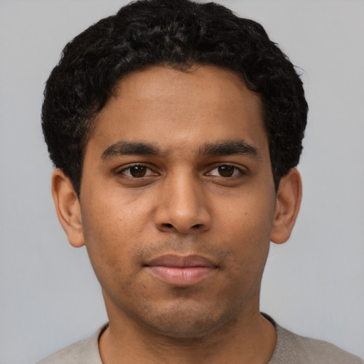 Neutral latino young-adult male with short  brown hair and brown eyes