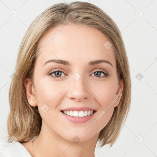 Joyful white young-adult female with medium  brown hair and green eyes