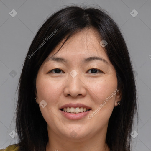 Joyful white adult female with medium  brown hair and brown eyes