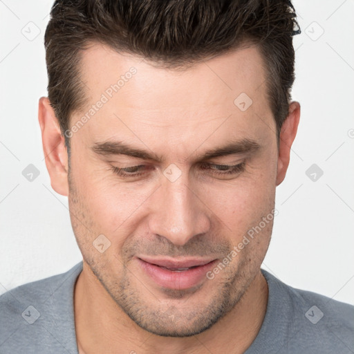 Joyful white adult male with short  brown hair and brown eyes