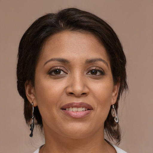 Joyful asian adult female with medium  brown hair and brown eyes