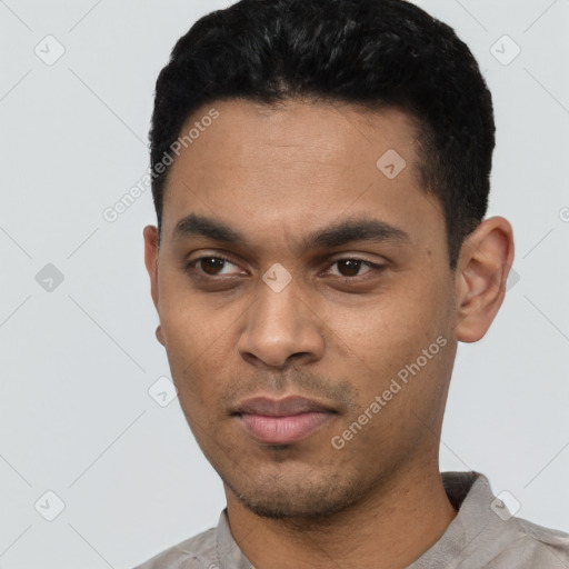 Neutral latino young-adult male with short  black hair and brown eyes