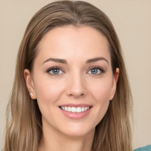 Joyful white young-adult female with long  brown hair and grey eyes