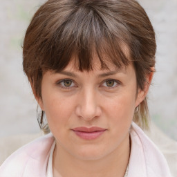 Joyful white adult female with medium  brown hair and grey eyes