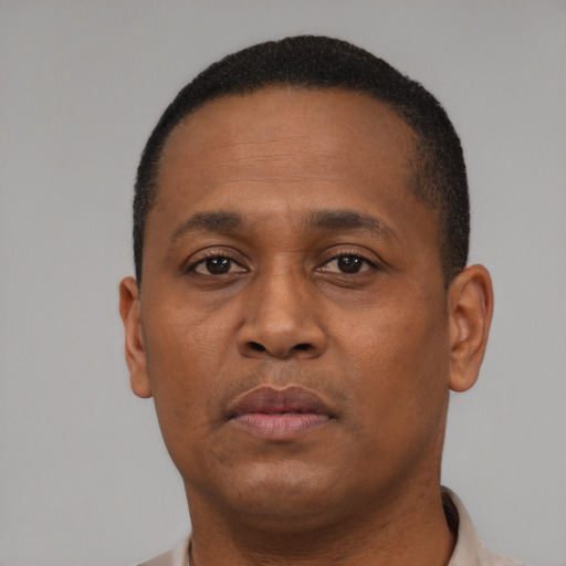 Neutral black young-adult male with short  black hair and brown eyes