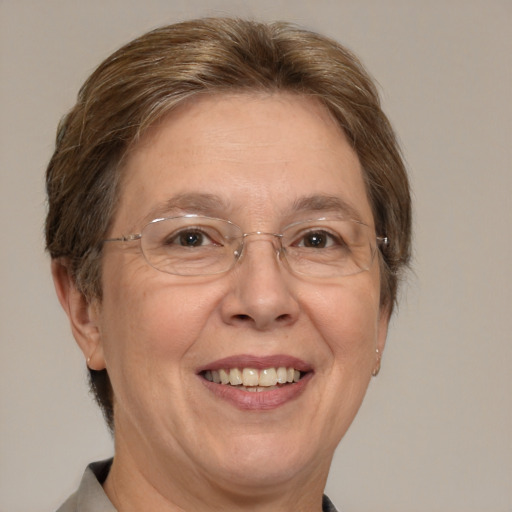 Joyful white middle-aged female with short  brown hair and brown eyes