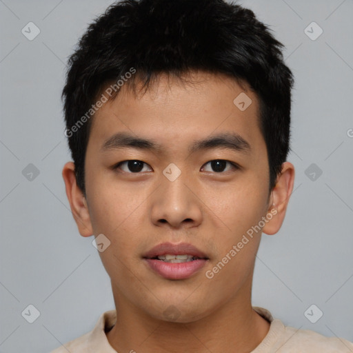 Joyful asian young-adult male with short  black hair and brown eyes