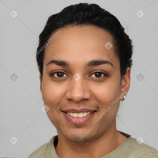 Joyful latino young-adult female with short  black hair and brown eyes