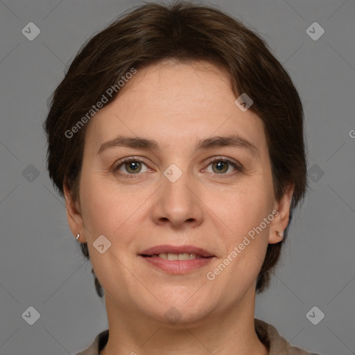 Joyful white adult female with short  brown hair and grey eyes