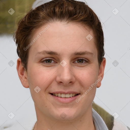 Joyful white young-adult female with short  brown hair and grey eyes