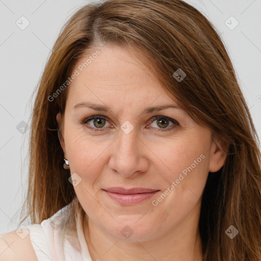 Joyful white adult female with long  brown hair and brown eyes