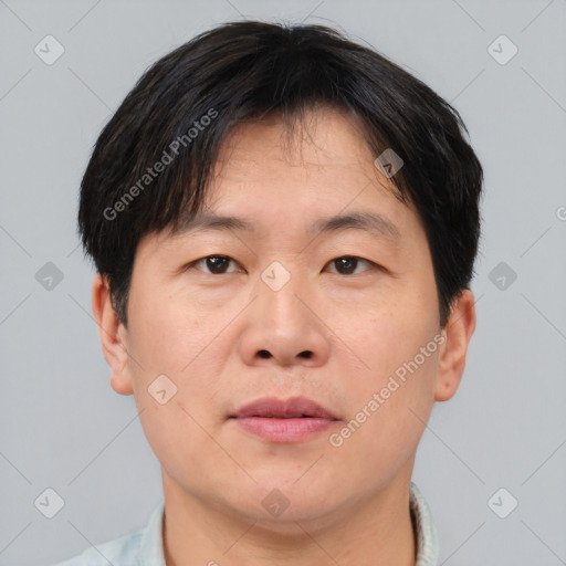 Neutral asian adult male with short  brown hair and brown eyes