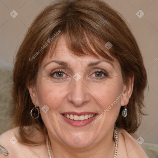 Joyful white adult female with medium  brown hair and blue eyes