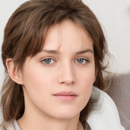 Neutral white young-adult female with medium  brown hair and grey eyes