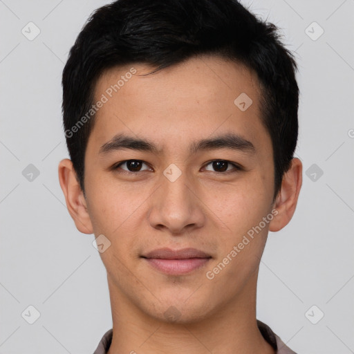 Joyful asian young-adult male with short  black hair and brown eyes