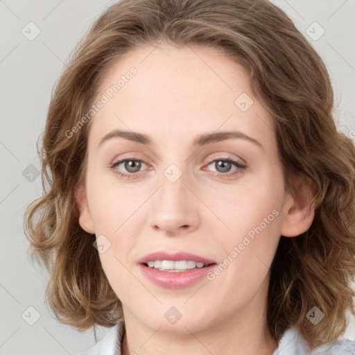 Joyful white young-adult female with medium  brown hair and green eyes