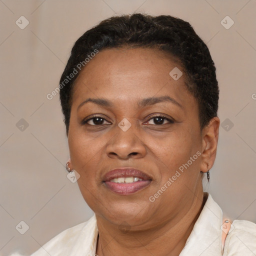 Joyful black adult female with short  brown hair and brown eyes