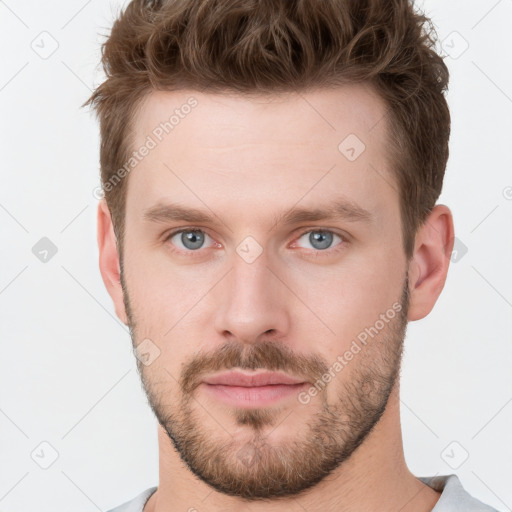 Neutral white young-adult male with short  brown hair and grey eyes