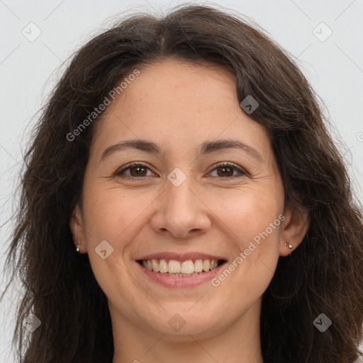 Joyful white adult female with long  brown hair and brown eyes