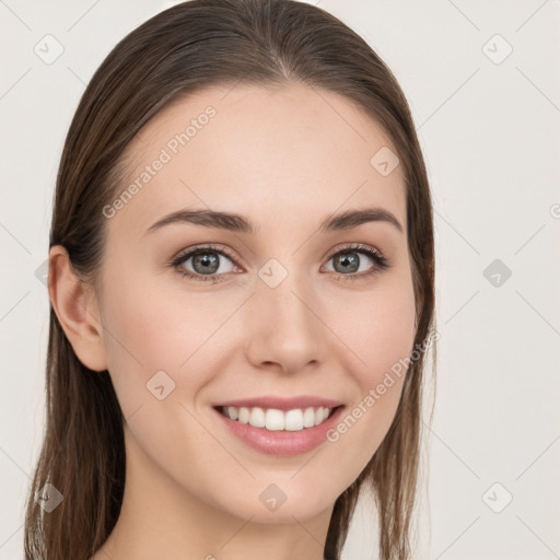 Joyful white young-adult female with long  brown hair and blue eyes