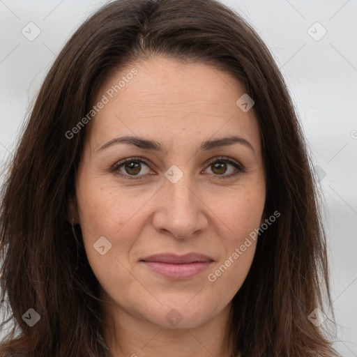 Joyful white adult female with long  brown hair and brown eyes