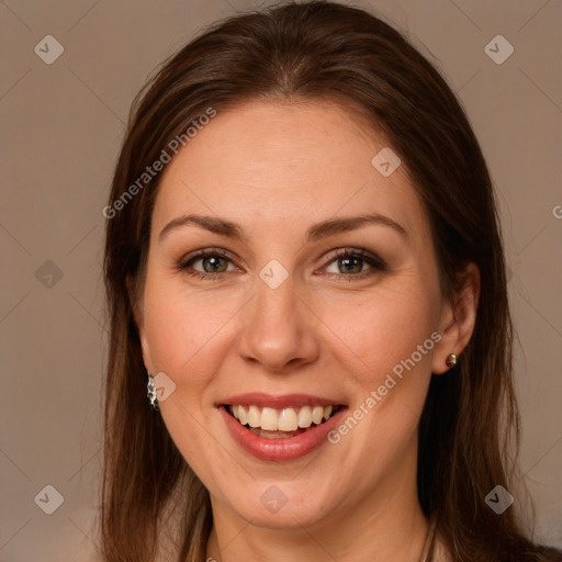 Joyful white young-adult female with long  brown hair and grey eyes