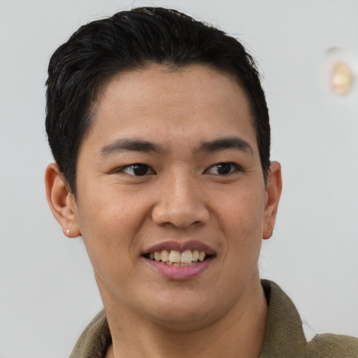 Joyful asian young-adult male with short  brown hair and brown eyes