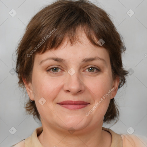 Joyful white adult female with medium  brown hair and grey eyes