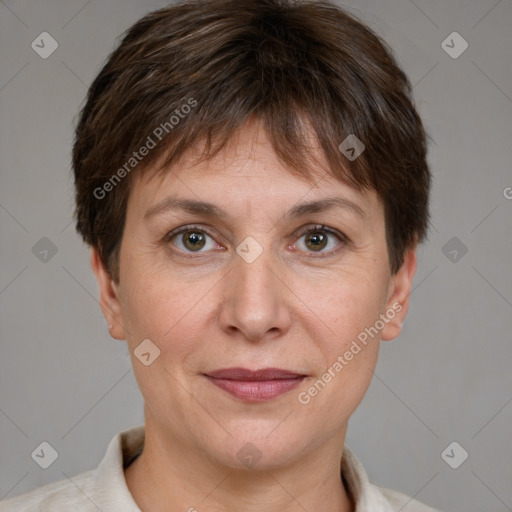 Joyful white adult female with short  brown hair and grey eyes