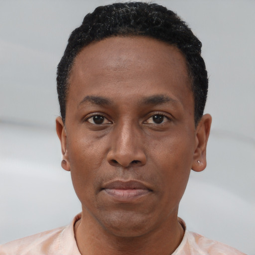 Neutral black young-adult male with short  black hair and brown eyes
