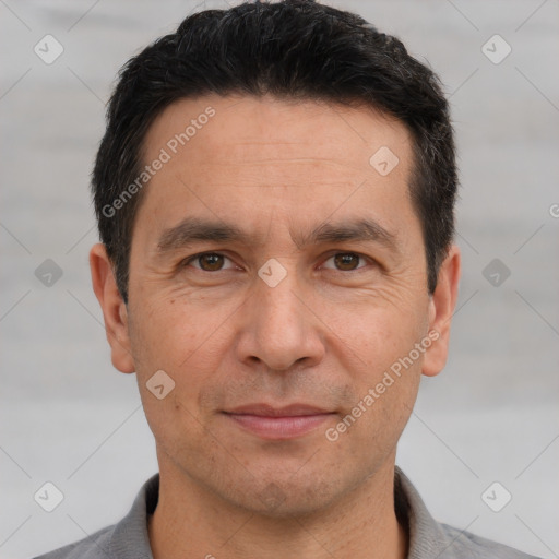 Joyful white adult male with short  brown hair and brown eyes