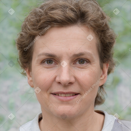 Joyful white adult female with short  brown hair and grey eyes