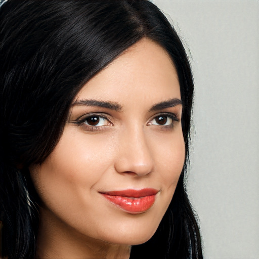 Joyful white young-adult female with long  black hair and brown eyes