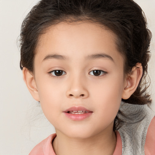 Joyful white child female with medium  brown hair and brown eyes