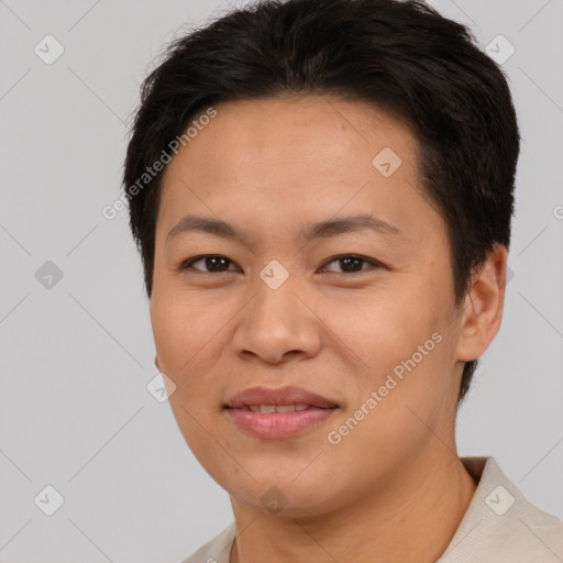 Joyful asian adult female with short  brown hair and brown eyes