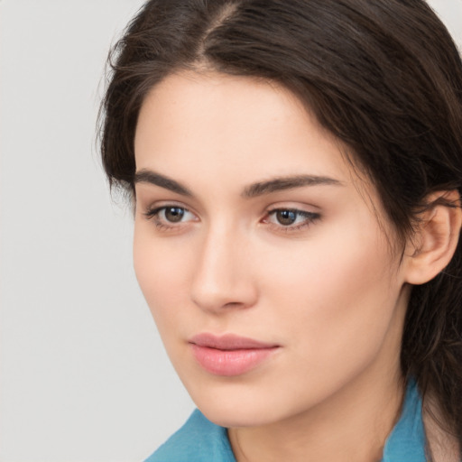 Neutral white young-adult female with medium  brown hair and brown eyes