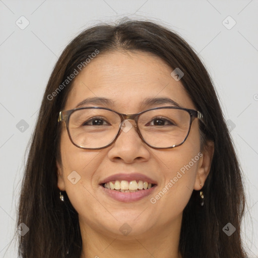 Joyful white adult female with long  brown hair and brown eyes