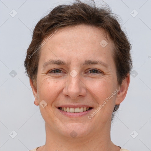 Joyful white adult female with short  brown hair and brown eyes