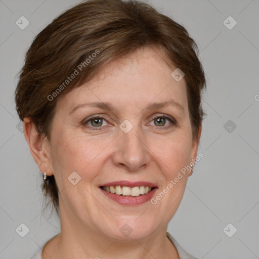 Joyful white adult female with short  brown hair and grey eyes